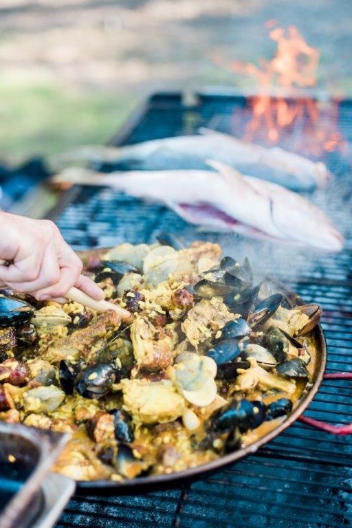Fish and Paella cooking on the grill
