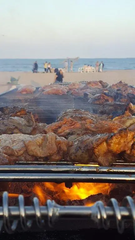 Chicken cooking on the beach