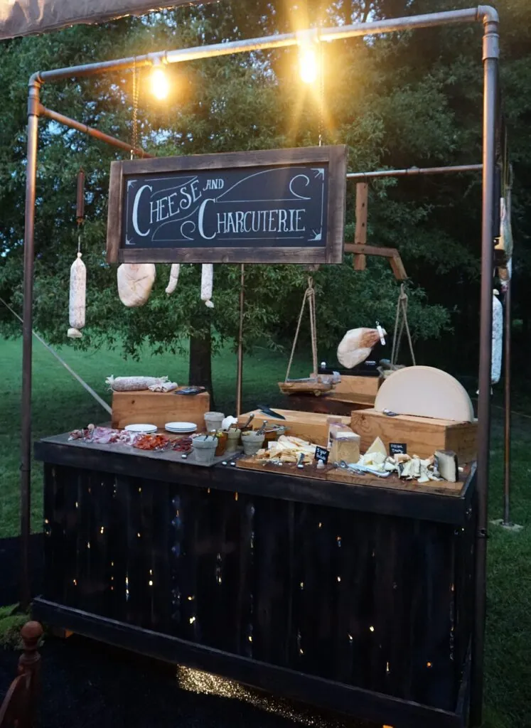 a food stand with a sign and lights